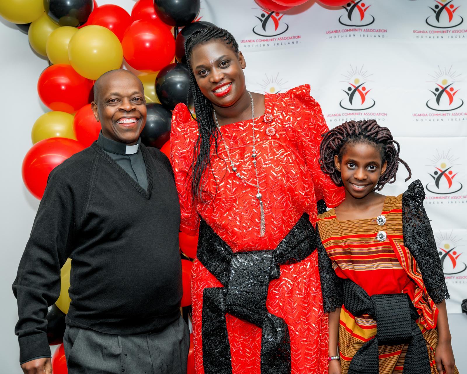 Family and community members posing at the UCANI photo wall